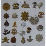 Twenty-three military regimental cap badges and other insignia, some copies: to include The Royal