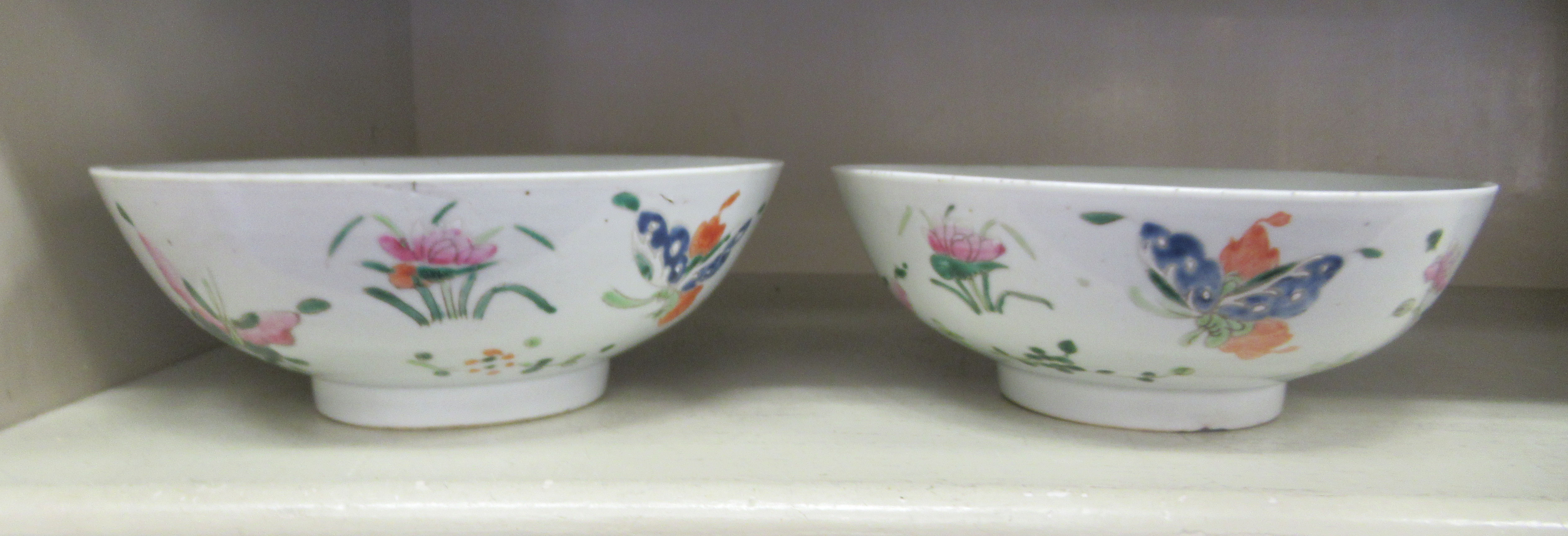 A pair of late 19thC Chinese porcelain shallow bowl, decorated in pastel tones with flora  7.5"dia