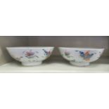 A pair of late 19thC Chinese porcelain shallow bowl, decorated in pastel tones with flora  7.5"dia