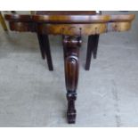 A Regency Continental inspired rosewood console table, the triple bow front raised on a central C-