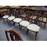 A harlequin set of five early 19thC ash, yew, beech and elm framed low Windsor wheelback chairs, the