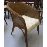 A 1950s gilt sprayed Lloyd Loom style tub chair