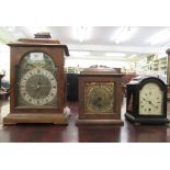 Three 20thC variously cased mantel timepieces, all faced by Roman dials  largest 11.5"h