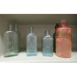 19thC and early 20thC glass bottles: to include a tinted pink pharmacy jar and stopper  9"h; and