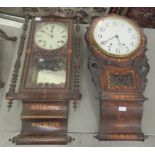 Two similar late 19thC American marquetry and walnut cased wall clocks; each 8 day movement faced by