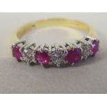 An 18ct gold eternity ring, set with alternating rubies and diamonds