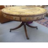 A late George III mahogany drum design table with an inset hide scriber, alternating frieze