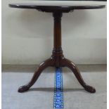 A George III mahogany tip-top pedestal table, over a turned column, raised on a tripod base  27.5"h