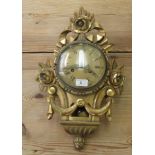 An early 20thC carved giltwood framed wall clock, faced by a brass framed Roman dial  22"h overall