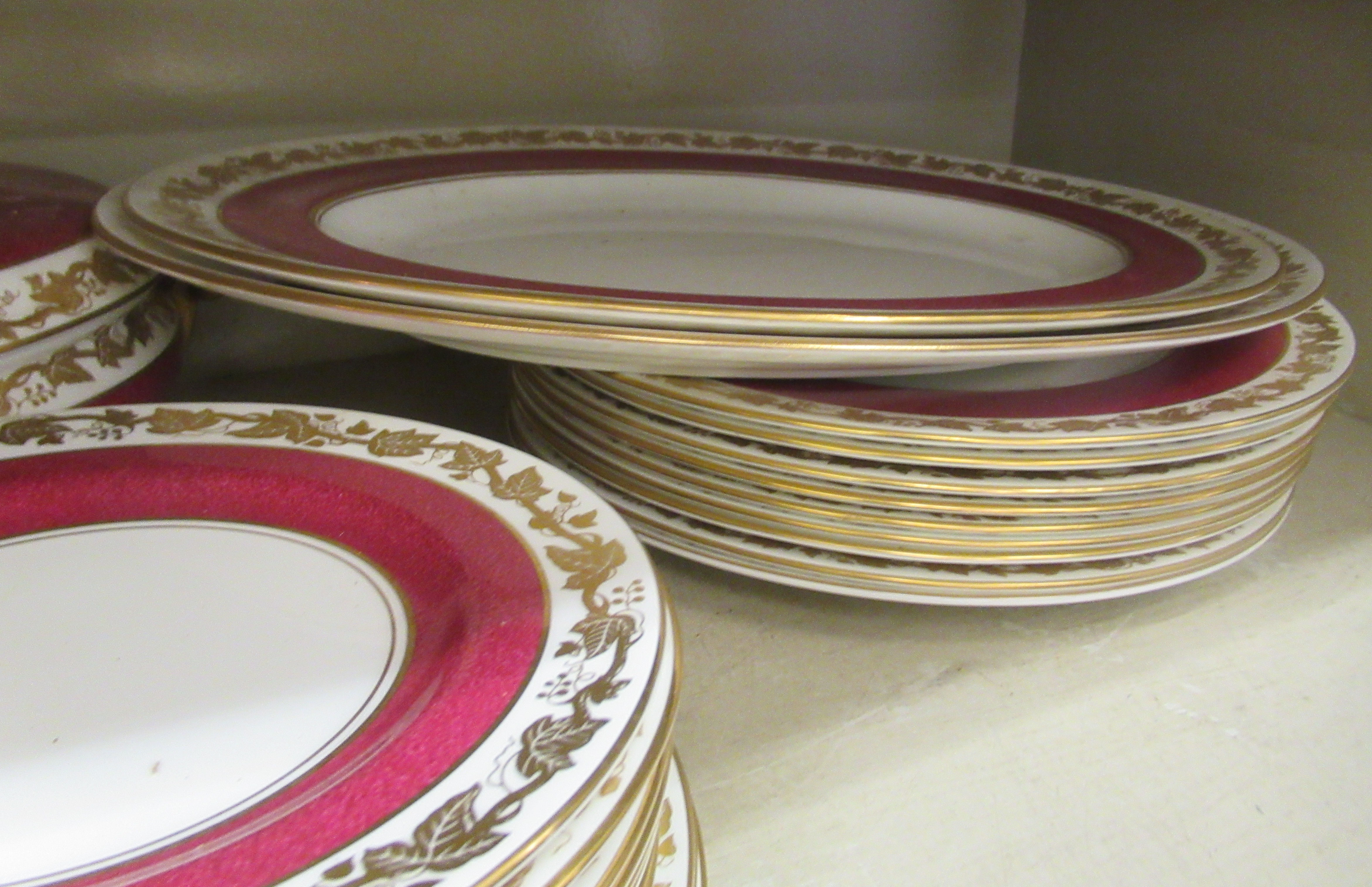 A Wedgwood china dinner service, decorated with maroon bands and a gilded fruiting vine border - Image 4 of 6
