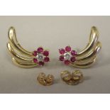 A pair of gold coloured metal ruby and diamond set earrings , fashioned as shooting stars  stamped