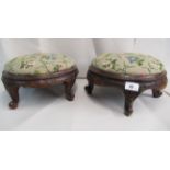 A pair of late 19thC Continental walnut framed footstools, each with a tapestry upholstered top