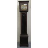 A 1920s oak cased Granddaughter clock; the 8 day  movement faced by a silvered Roman dial  51"h