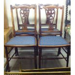 A set of four Edwardian mahogany framed pierced splat back chairs, the later fabric covered seats