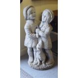 A composition stone group, a young boy and girl with a dachshund  28"h