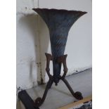 A late 19thC cast iron terrace vase of conical form, raised on a splayed, tripod feet  20"h