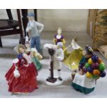 Six Royal Doulton china figures  largest 8"h; and a Nao porcelain figure, a golfer  11"h