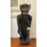 A modern stained and carved hardwood model, a seated monkey  19"h