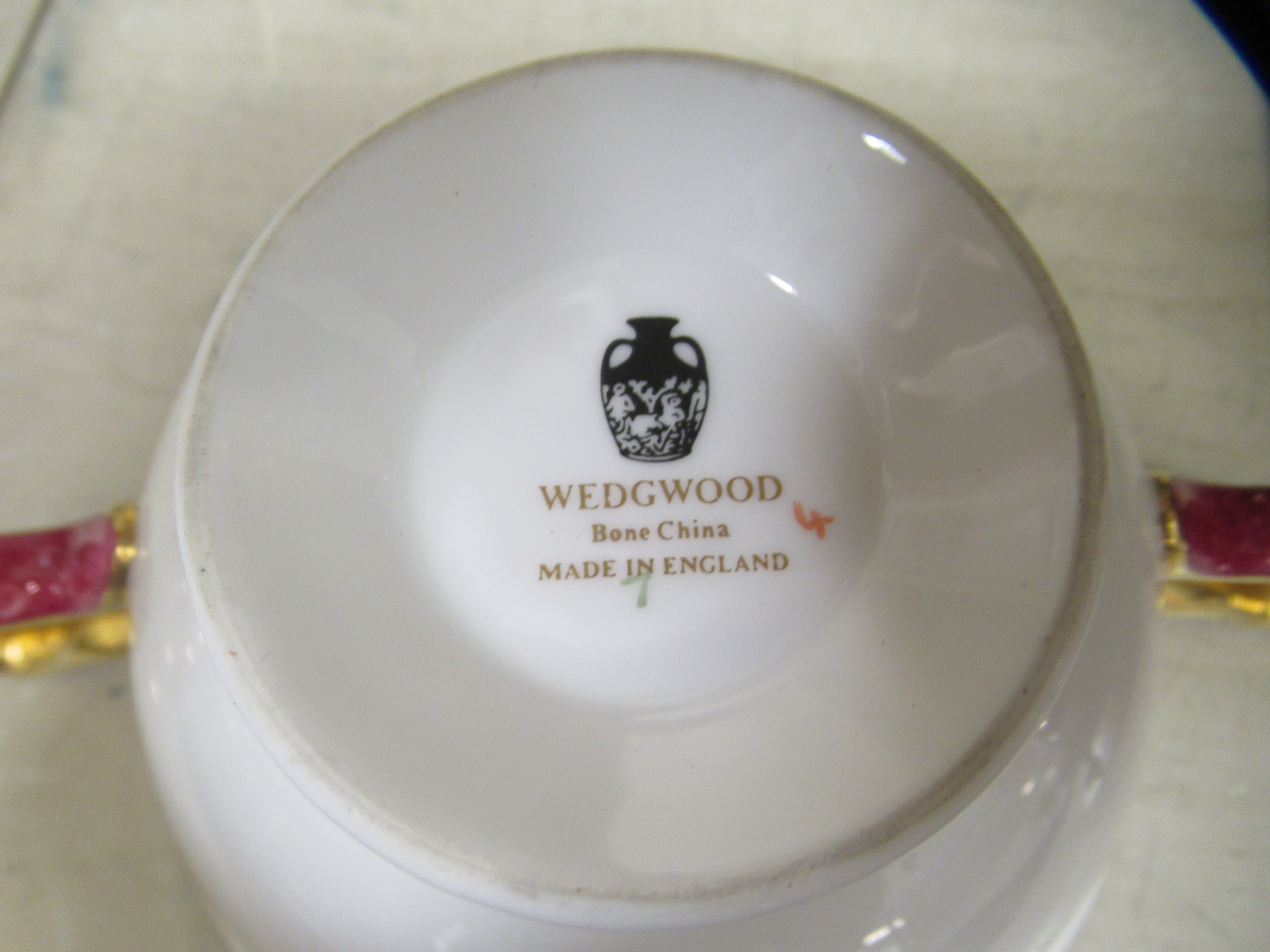 A Wedgwood china dinner service, decorated with maroon bands and a gilded fruiting vine border - Image 6 of 6