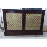 A late Victorian mahogany chiffonier, the drop-in mottled marble top over a pair of lattice brass