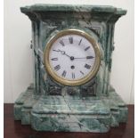 An Art Deco inspired marbleised effect mantel clock, on a plinth; the movement faced by a Roman dial