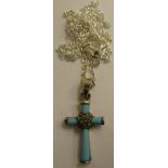 A silver coloured metal and turquoise set pendant cross, on a fine neckchain and dog-clip clasp