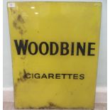 A vintage printed black on yellow glass sign 'Woodbine Cigarettes'  20" x 25"
