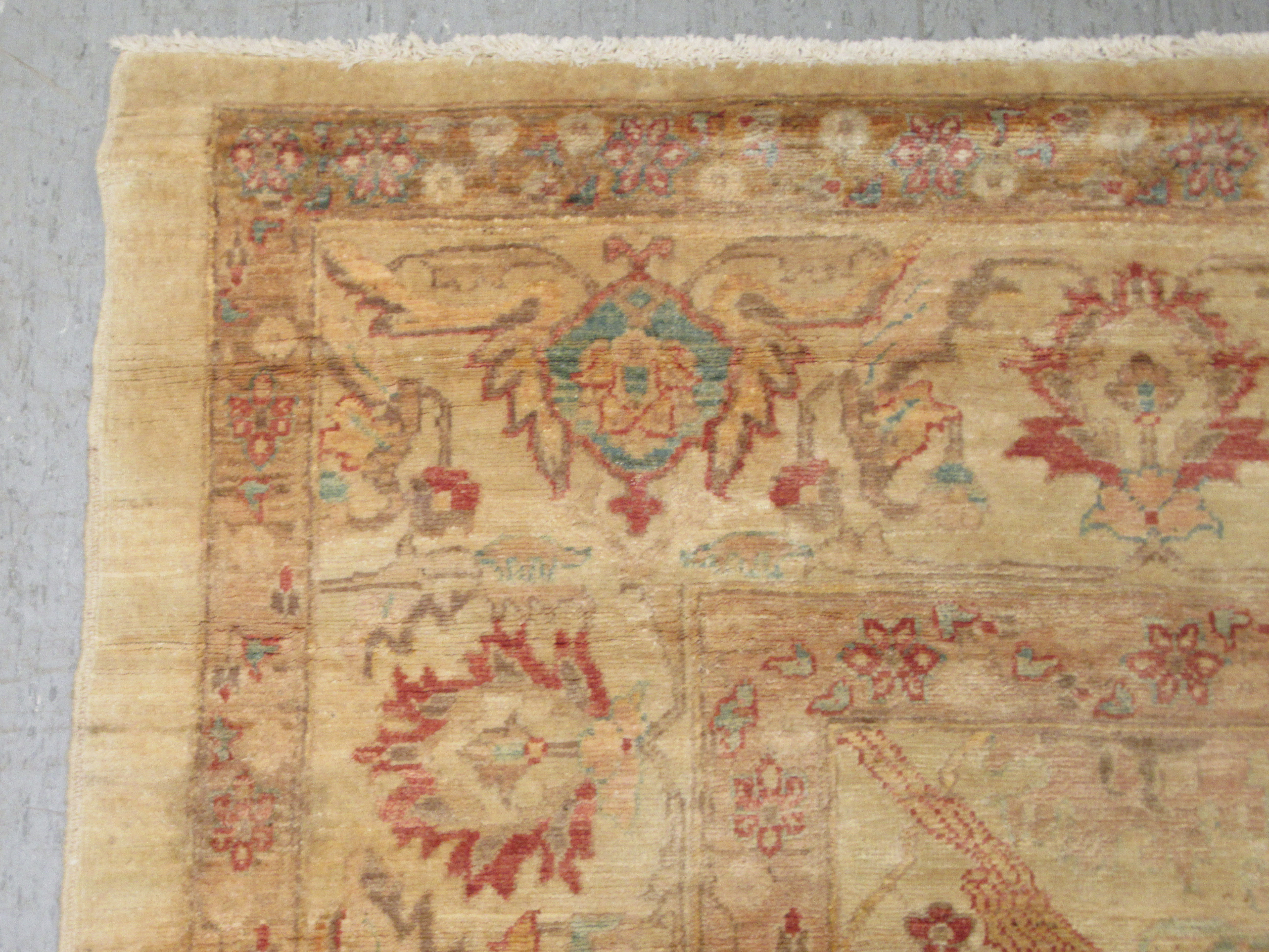 A Persian carpet, decorated with repeating stylised floral designs, on a cream coloured ground  116" - Image 4 of 5