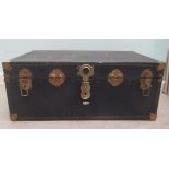 An early 20thC studded black canvas effect cabin trunk with straight sides and a hinged lid  15"h