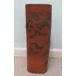 A mid 20thC Chinese terracotta stickstand, decorated in relief with clouds and dragons  24"h