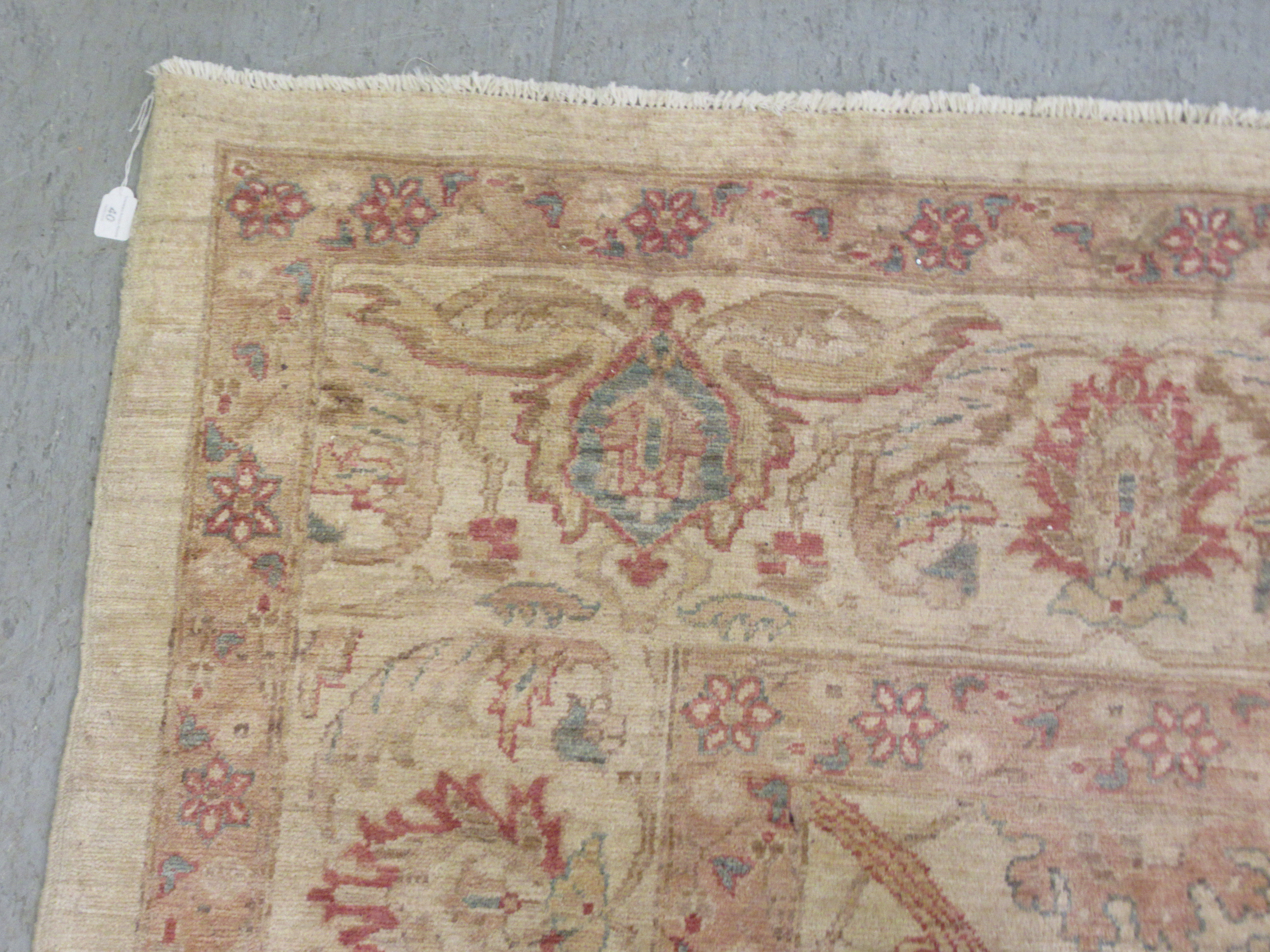 A Persian carpet, decorated with repeating stylised floral designs, on a cream coloured ground  116" - Image 3 of 5