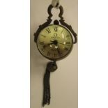 A modern brass cased and cast glass pendant, spherical timepiece, faced by a Roman dial