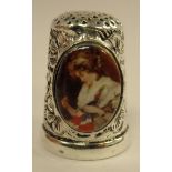 A silver coloured metal and enamel thimble