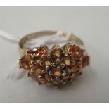 A gold coloured metal claw set citrine cluster ring  stamped 10k
