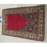 A Persian prayer rug, on a multi-coloured ground  40" x 64"