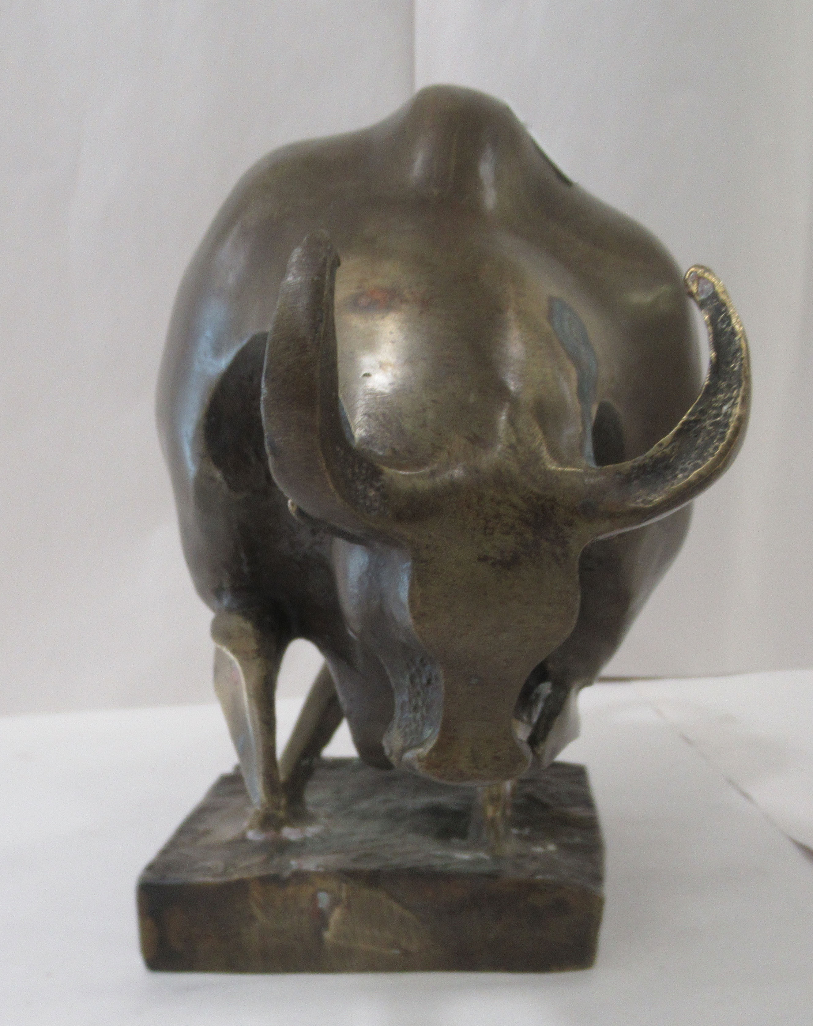 A Salvador Dali inspired abstract cast bronze ornament, a bull, on a plinth  8"h - Image 2 of 3