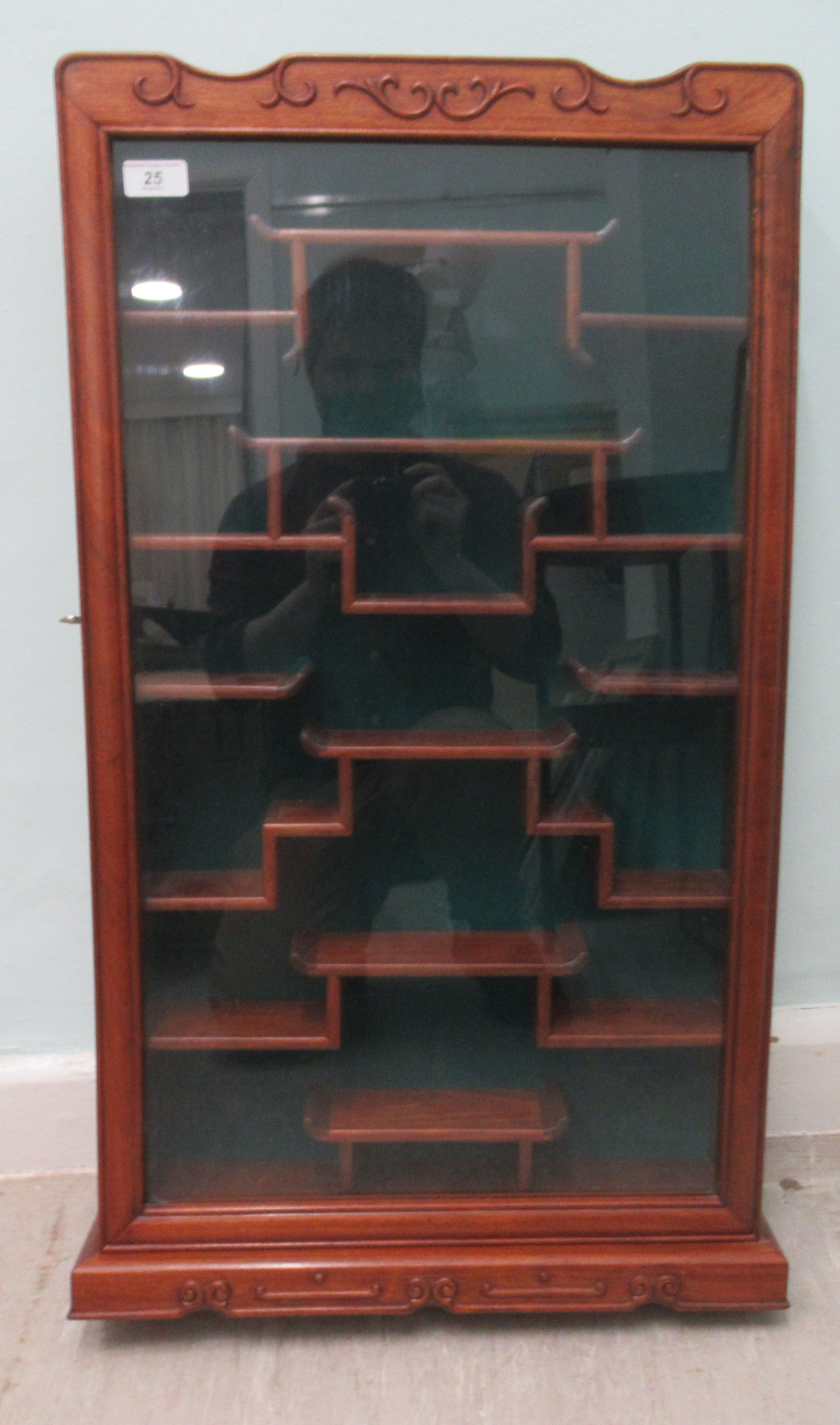 A post 1950s Chinese deep set framed and glazed netsuke cabinet with fitted offset shelves  33"h