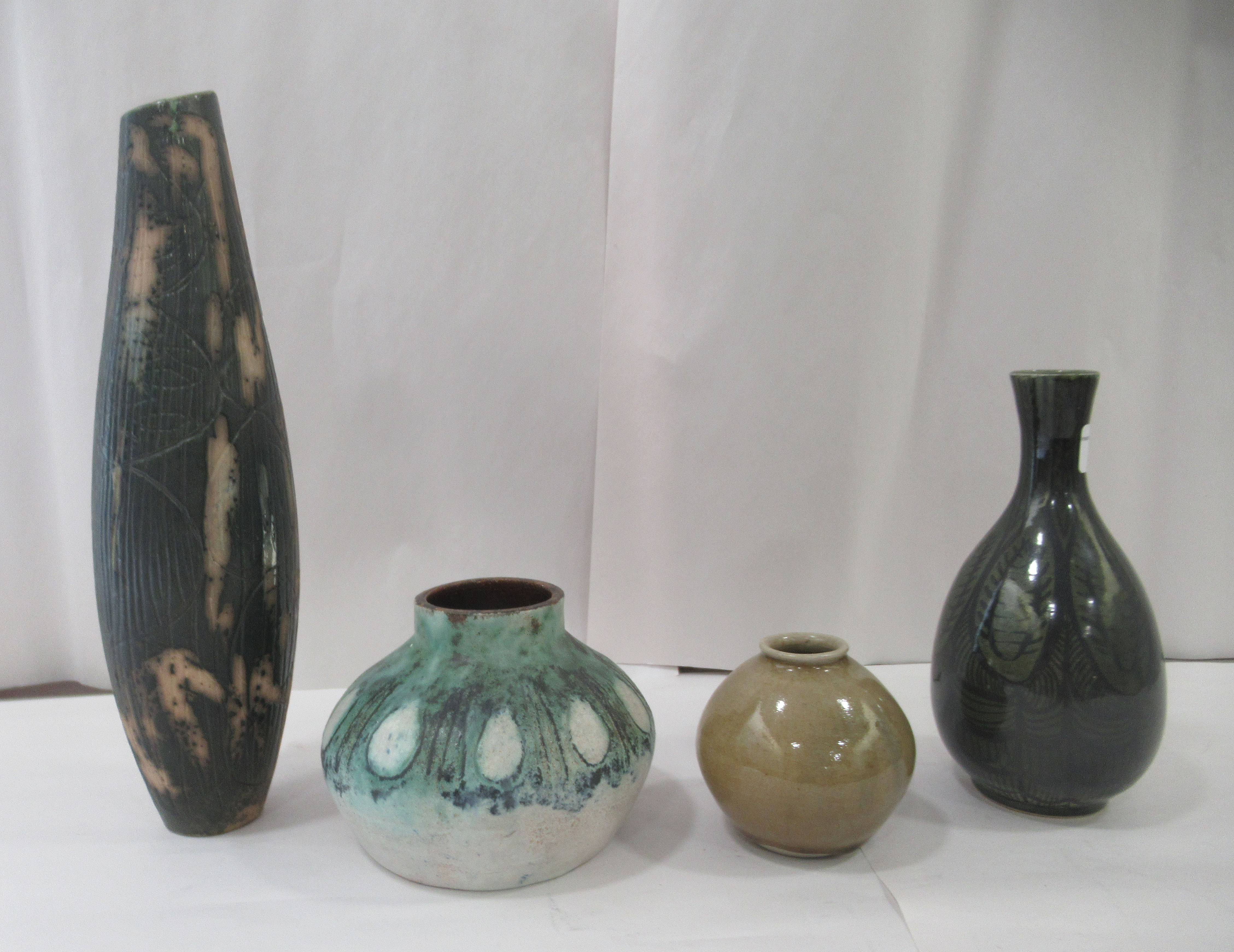 Four items of post 1960s studio pottery vases of various form, some bearing impressed initials