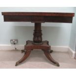 A Regency mahogany card table, the rotating foldover top enclosing a baize lined interior, over a