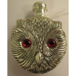 A silver coloured metal novelty perfume bottle, fashioned as an owl's head with glass eyes