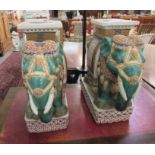 A pair of 20thC painted ceramic garden seats, fashioned as ceremonial Indian elephants  22"h