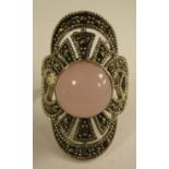 A silver coloured metal marcasite and rose quartz set dress ring  stamped 925