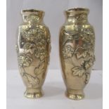 A pair of post 1950s Japanese inspired gilded bronzed vases of tapered form, decorated in relief