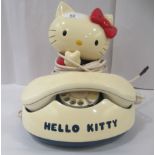 A coloured plastic rotating dial telephone, fashioned as 'Hello Kitty'  9"h