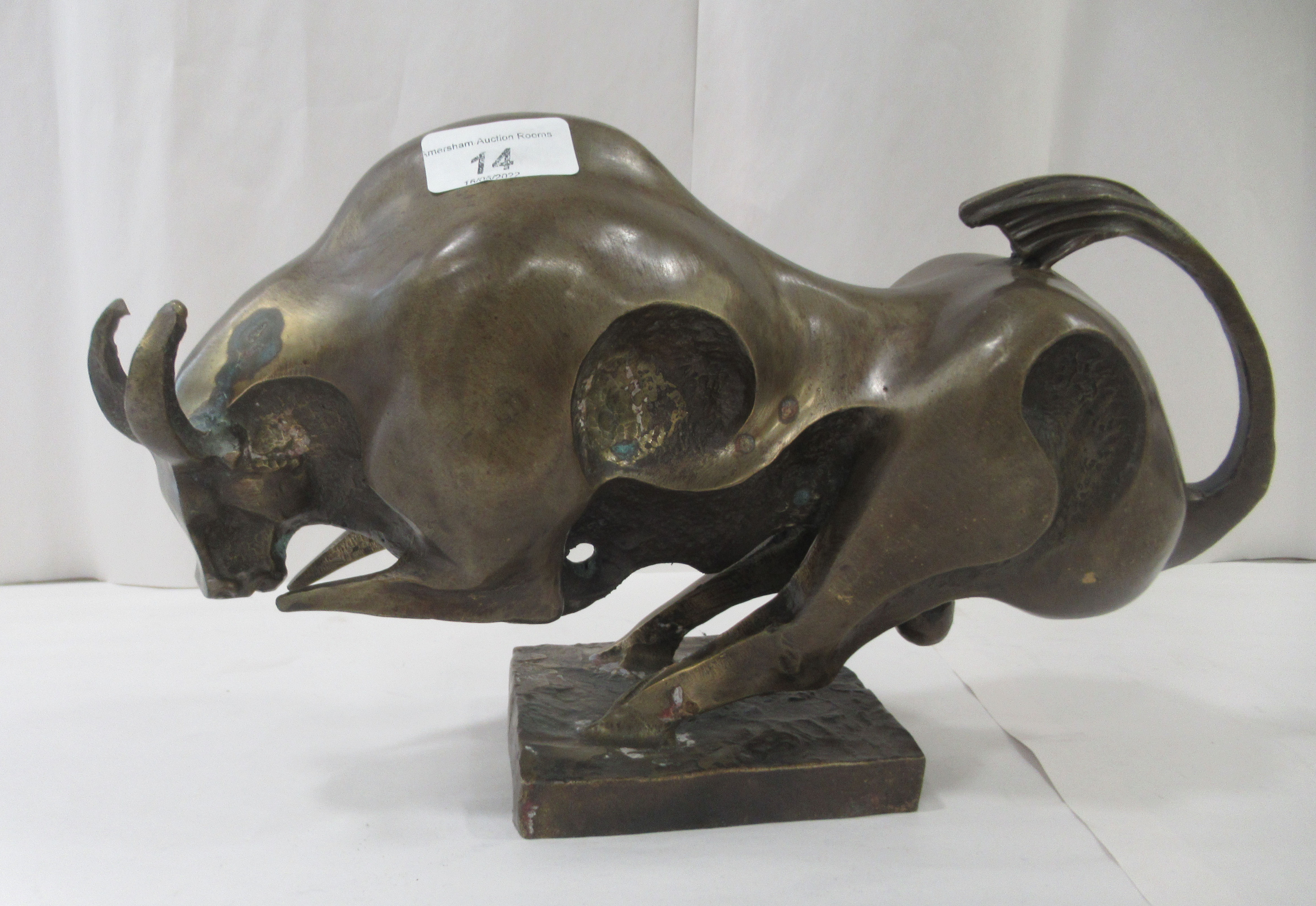 A Salvador Dali inspired abstract cast bronze ornament, a bull, on a plinth  8"h