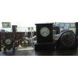 Four clocks: to include a 1930s slate cased example, faced by a Roman dial  13.5"h  10"w