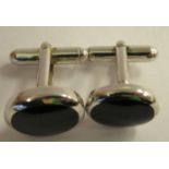 A pair of silver coloured metal and onyx set cufflinks