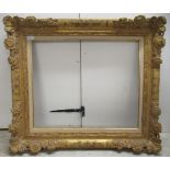 An early 20thC moulded gilt frame (only) interior measurements of 21" x 25"