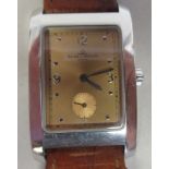 A Baume & Mercier Hampton stainless steel cased wristwatch, faced by an Arabic dial with