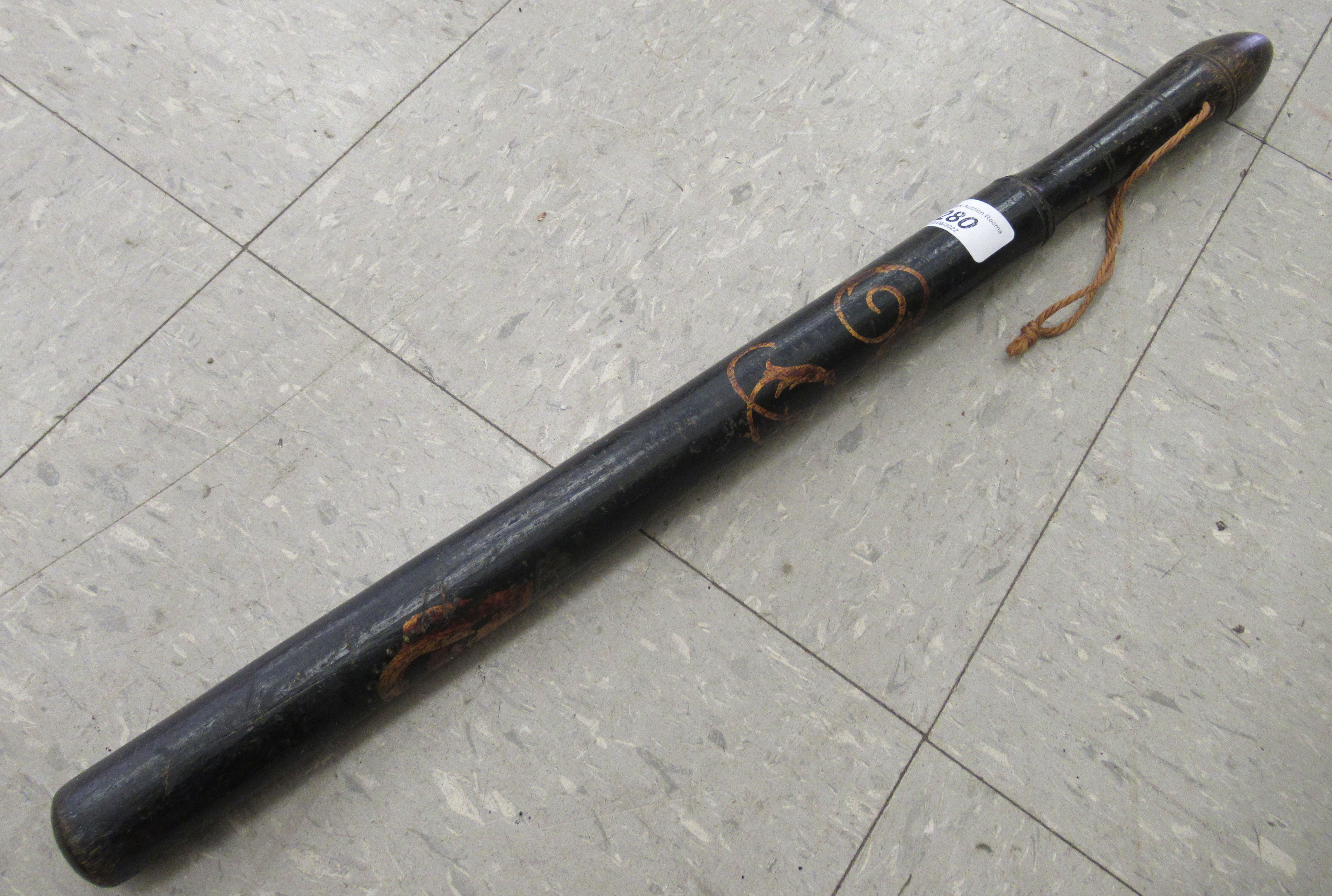 A Victorian ebonised and painted truncheon  21"L